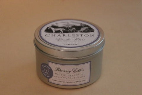 Soy candle tin that smells like blueberry cobbler. 